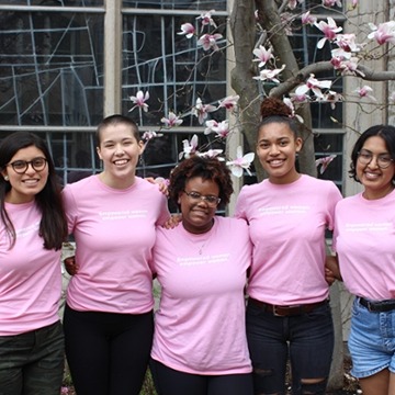 A group of Northwestern women wearing pink shirts