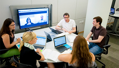 group with wall of post it notes