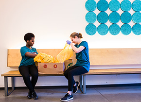 two students volunteering