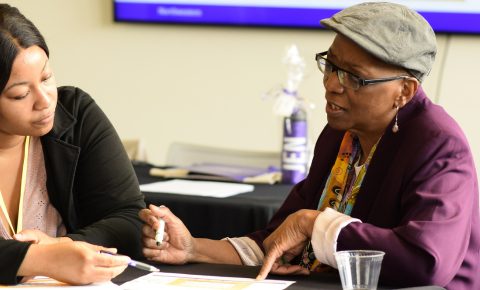 An image of Paula Hooper and a participant speaking.